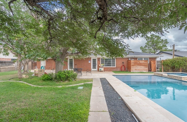 1703 Laurel Ave, Odessa, TX 79761 - view of swimming pool featuring a fenced backyard, a patio area, and a pool with connected hot tub