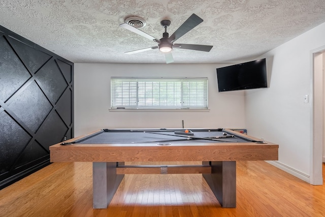 1703 Laurel Ave, Odessa, TX 79761 - rec room with billiards, wood finished floors, ceiling fan, and a textured ceiling