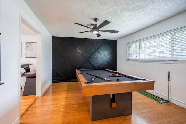 1703 Laurel Ave, Odessa, TX 79761 - playroom with light wood-style floors, ceiling fan, a textured ceiling, billiards, and an accent wall