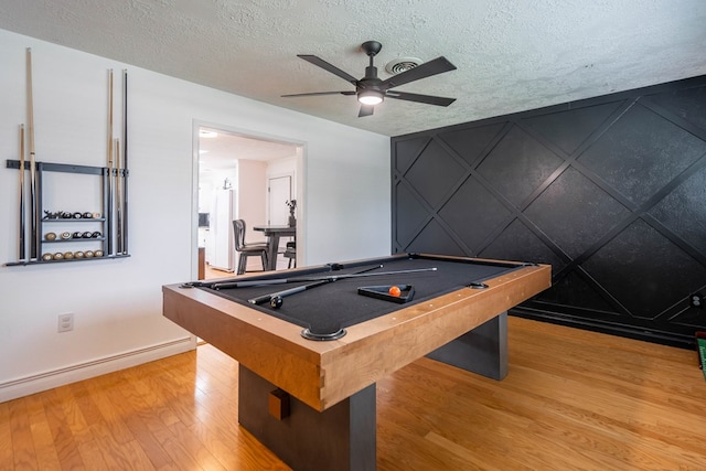 1703 Laurel Ave, Odessa, TX 79761 - playroom featuring wood finished floors, ceiling fan, pool table, and a textured ceiling