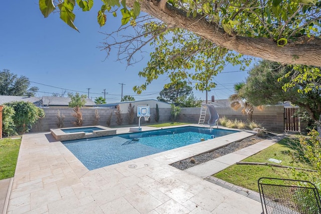 1703 Laurel Ave, Odessa, TX 79761 - view of swimming pool featuring a water slide, a fenced backyard, a patio, and a pool with connected hot tub