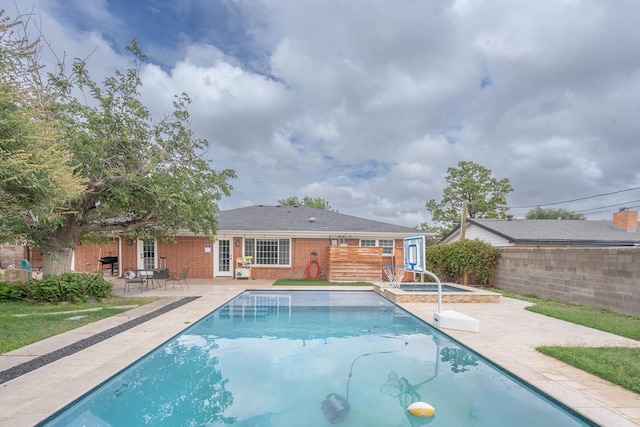 1703 Laurel Ave, Odessa, TX 79761 - view of swimming pool with a patio area and a pool with connected hot tub