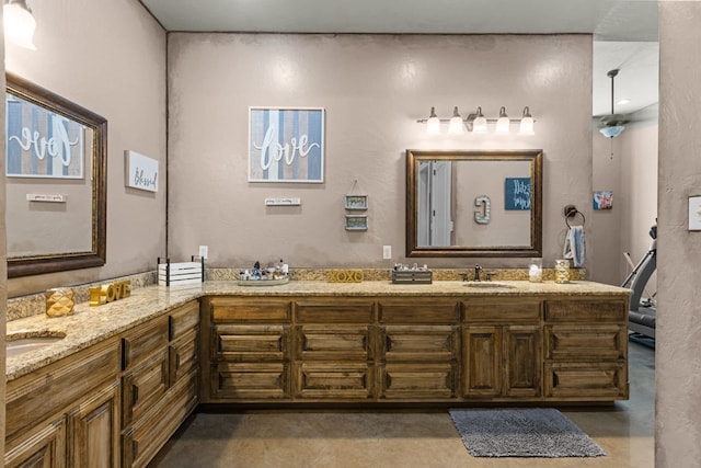 bathroom featuring vanity and concrete flooring