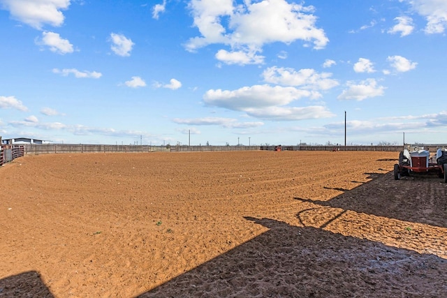 view of yard with a rural view