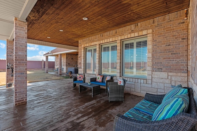 wooden deck featuring an outdoor living space