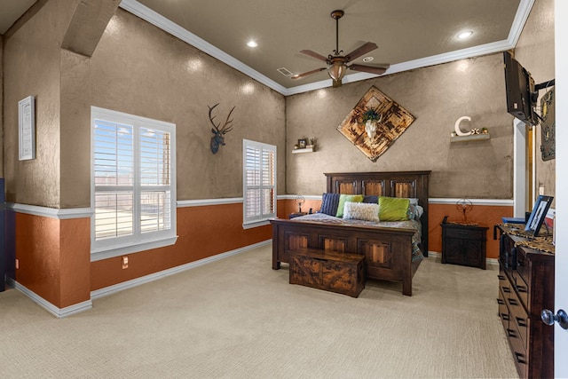 carpeted bedroom featuring crown molding and ceiling fan