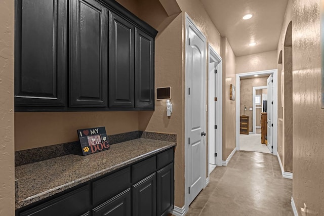 kitchen featuring dark stone counters