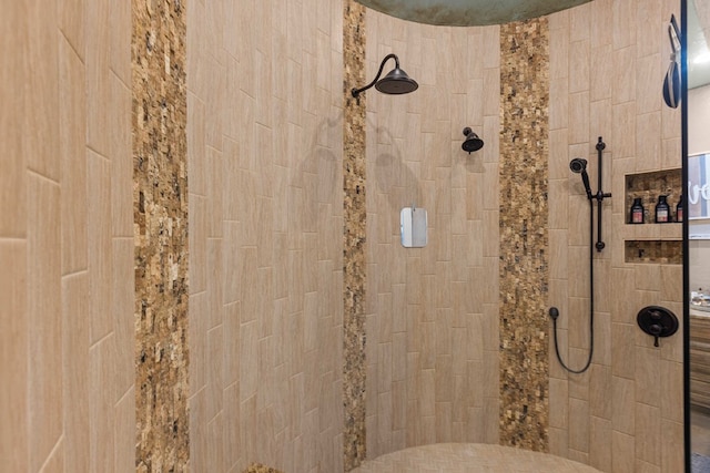 bathroom with tiled shower