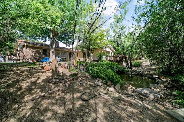 2100 Edgemere Rd, Big Spring, TX 79720 - view of yard featuring a wooden deck
