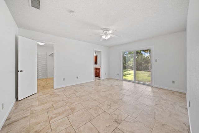 2100 Edgemere Rd, Big Spring, TX 79720 - unfurnished room featuring a ceiling fan, a textured ceiling, and a smoke detector