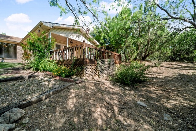 2100 Edgemere Rd, Big Spring, TX 79720 - view of home's exterior featuring a ceiling fan and a wooden deck