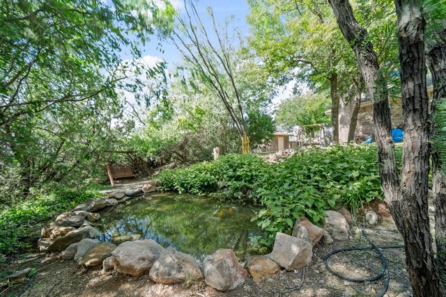 2100 Edgemere Rd, Big Spring, TX 79720 - view of yard featuring a garden pond