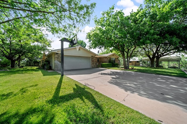 2100 Edgemere Rd, Big Spring, TX 79720 - view of front facade featuring a garage, a front yard, and concrete driveway