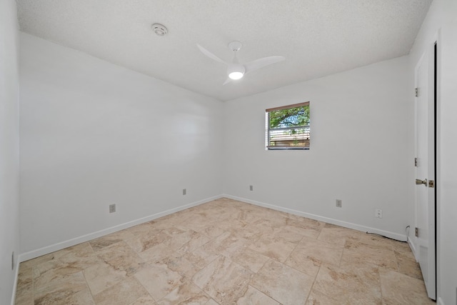 2100 Edgemere Rd, Big Spring, TX 79720 - empty room with a smoke detector, a ceiling fan, and a textured ceiling
