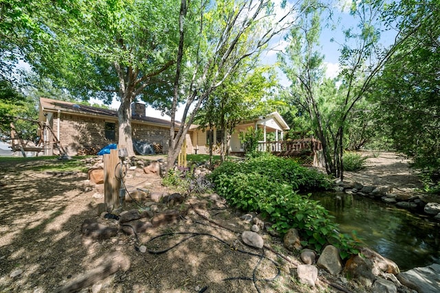 2100 Edgemere Rd, Big Spring, TX 79720 - back of property with a wooden deck and brick siding
