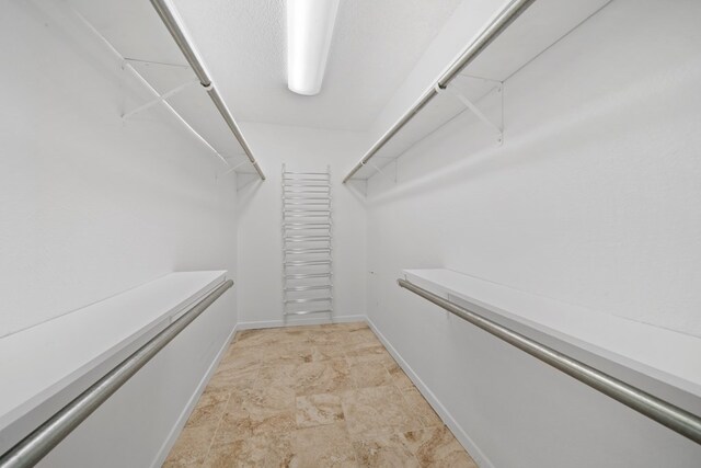 2100 Edgemere Rd, Big Spring, TX 79720 - walk in closet with stone finish floors