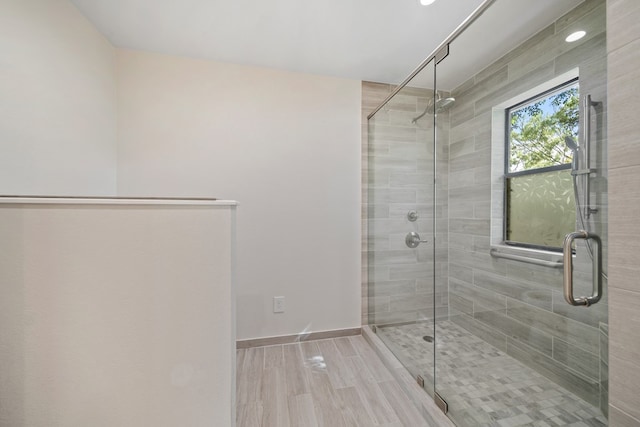 2100 Edgemere Rd, Big Spring, TX 79720 - full bathroom featuring a shower stall, wood finished floors, and recessed lighting