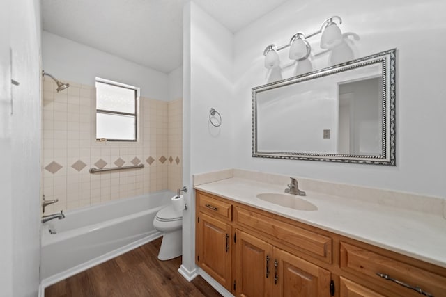 2100 Edgemere Rd, Big Spring, TX 79720 - bathroom with vanity, wood finished floors, and tub / shower combination