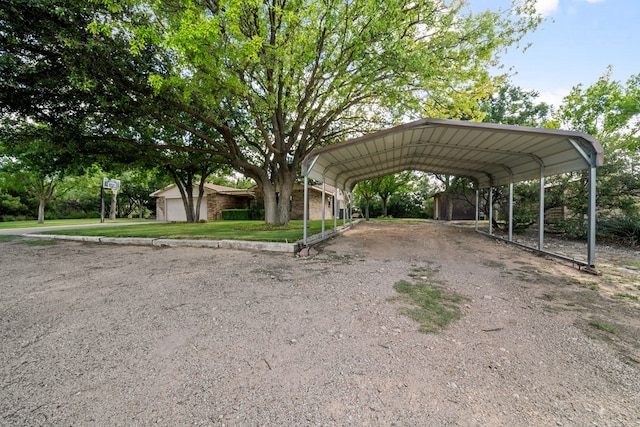 2100 Edgemere Rd, Big Spring, TX 79720 - view of vehicle parking with a detached carport and dirt driveway