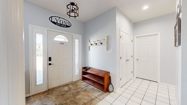 foyer featuring light tile patterned floors