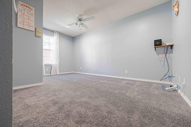 unfurnished room featuring ceiling fan, carpet floors, and a textured ceiling