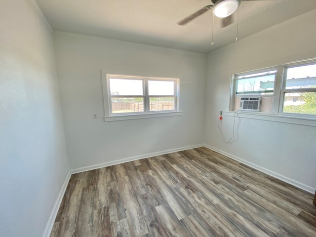 3007 S Anderson Rd, Big Spring, TX 79720 - empty room with healthy amount of natural light, wood finished floors, and ceiling fan