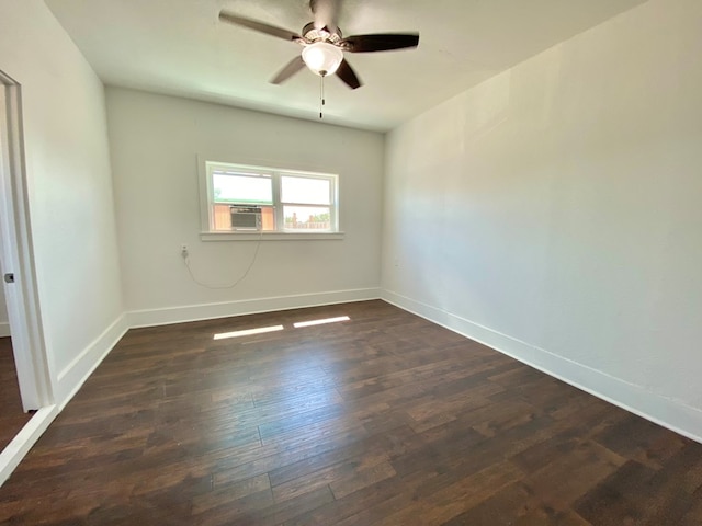3007 S Anderson Rd, Big Spring, TX 79720 - empty room featuring dark wood finished floors, ceiling fan, and cooling unit