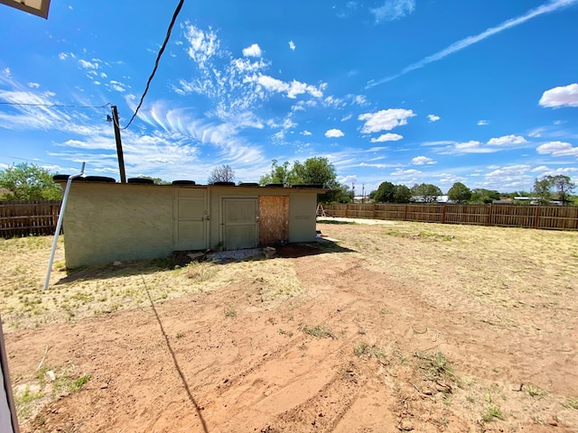 3007 S Anderson Rd, Big Spring, TX 79720 - fenced backyard featuring a storage shed