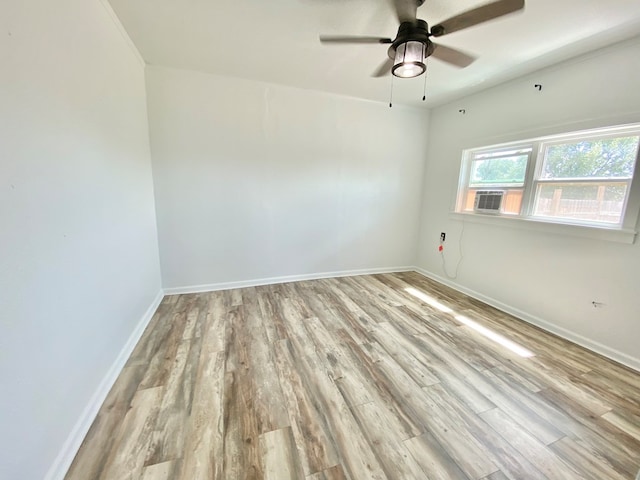 3007 S Anderson Rd, Big Spring, TX 79720 - empty room featuring wood finished floors, a ceiling fan, and cooling unit