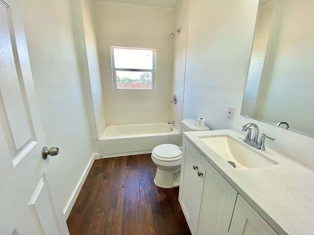 3007 S Anderson Rd, Big Spring, TX 79720 - full bathroom featuring vanity, hardwood / wood-style floors, and shower / tub combination