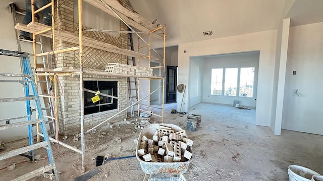 unfurnished living room with a brick fireplace