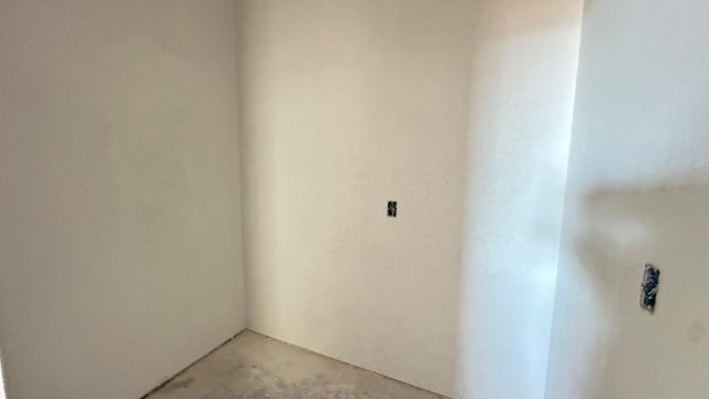 spare room with concrete floors