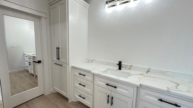 2118 S County Rd 1059, Midland, TX 79706 - bathroom with vanity and wood finished floors