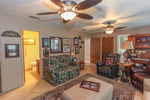 702 Capri Ct, Big Spring, TX 79720 - living room with ceiling fan and light tile patterned floors