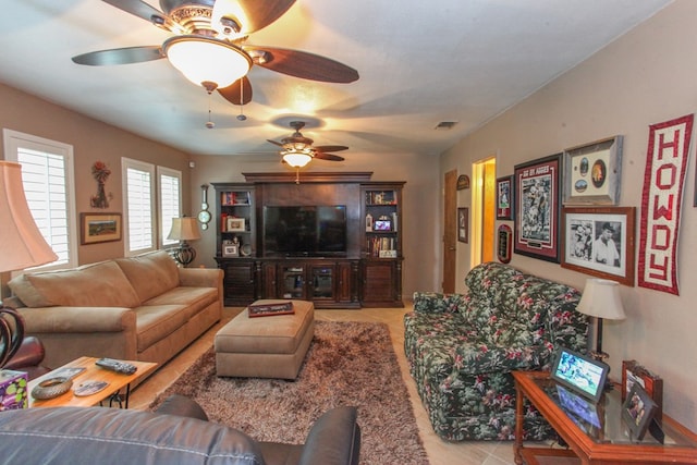 702 Capri Ct, Big Spring, TX 79720 - tiled living room with a ceiling fan