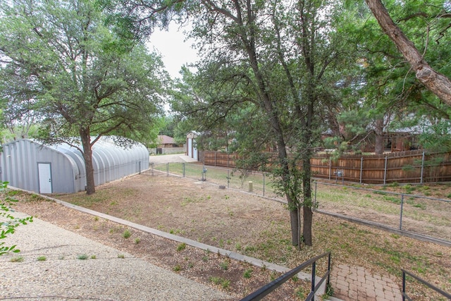 702 Capri Ct, Big Spring, TX 79720 - view of yard with an outdoor structure