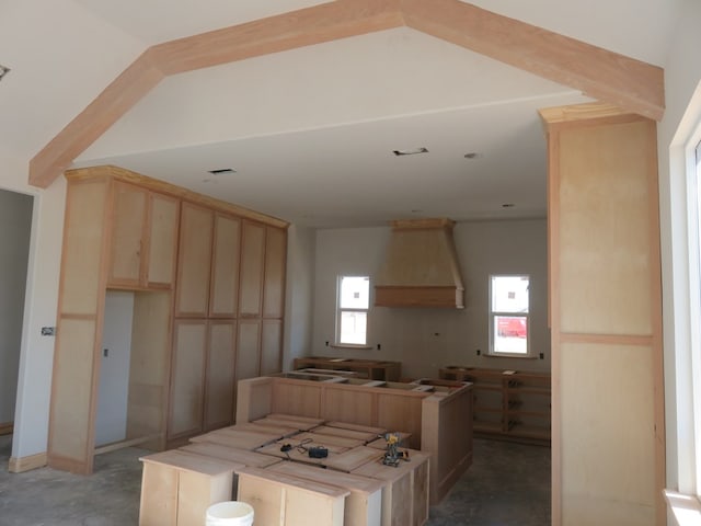 kitchen featuring light brown cabinetry and a center island