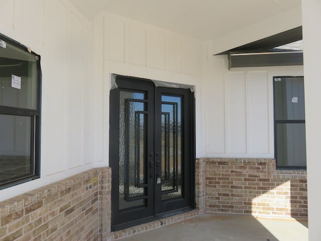 view of exterior entry featuring french doors