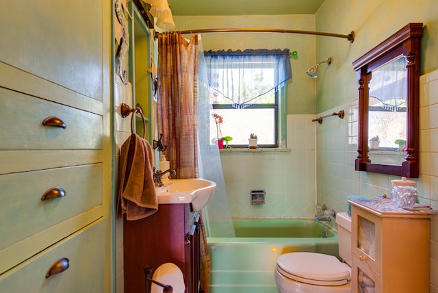 707 E County Rd 132, Midland, TX 79706 - full bath featuring vanity, toilet, tile walls, and shower / bathtub combination