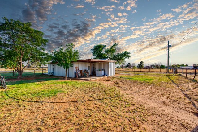 707 E County Rd 132, Midland, TX 79706 - view of yard with fence and an outbuilding