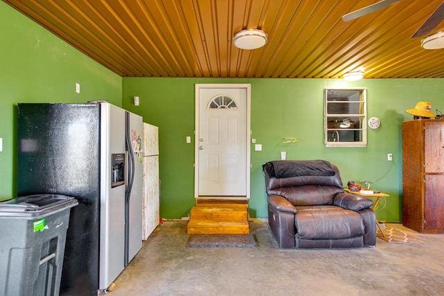 707 E County Rd 132, Midland, TX 79706 - kitchen featuring stainless steel fridge, wood ceiling, and finished concrete flooring