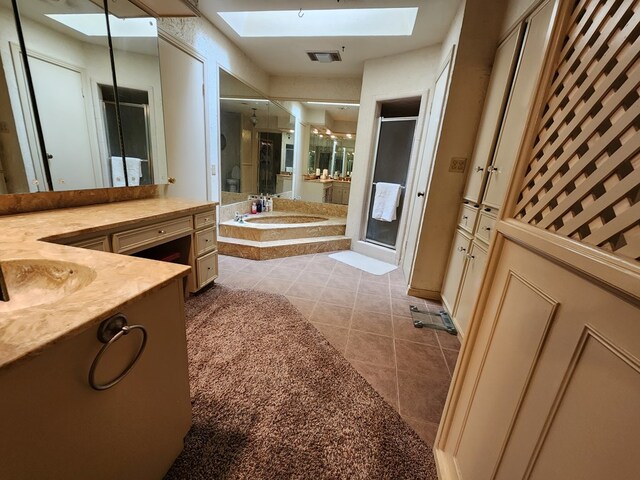 bathroom with tile patterned floors, vanity, and independent shower and bath