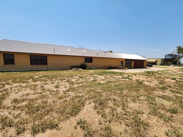 rear view of property featuring a patio