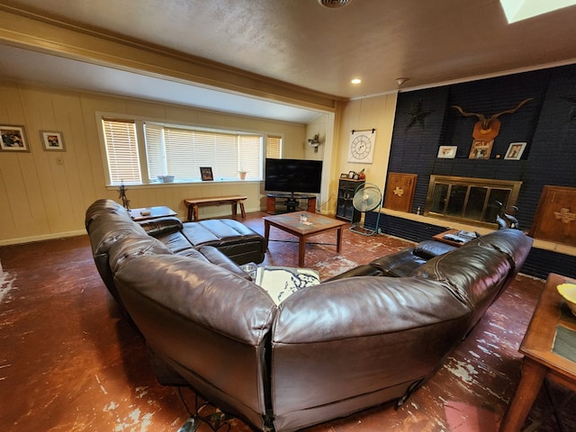 living room with crown molding and a brick fireplace