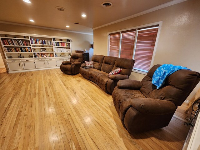 living room featuring light hardwood / wood-style floors and ornamental molding