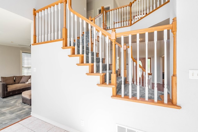 209 Bayberry Pkwy, Midland, TX 79705 - stairs featuring tile patterned flooring, a ceiling fan, and baseboards