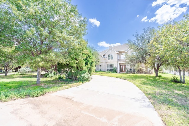 209 Bayberry Pkwy, Midland, TX 79705 - view of property hidden behind natural elements with a front yard and stucco siding