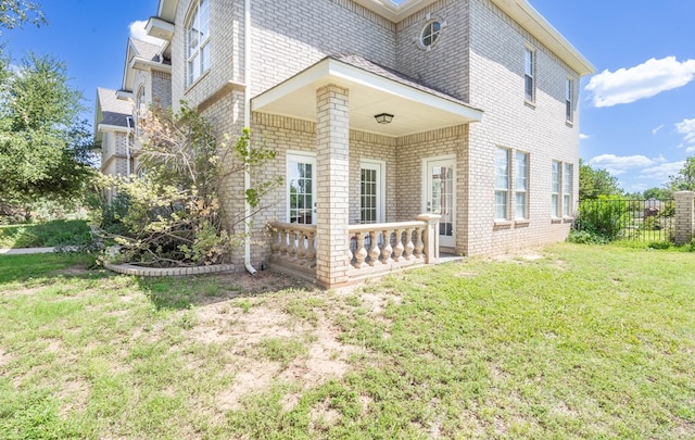 209 Bayberry Pkwy, Midland, TX 79705 - view of property exterior featuring a lawn and brick siding