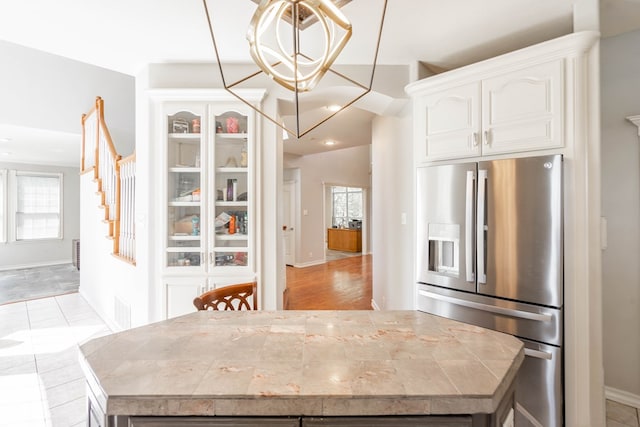 209 Bayberry Pkwy, Midland, TX 79705 - unfurnished dining area featuring baseboards and a chandelier
