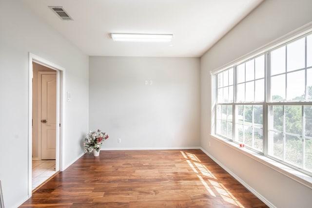 209 Bayberry Pkwy, Midland, TX 79705 - unfurnished room with wood finished floors and baseboards